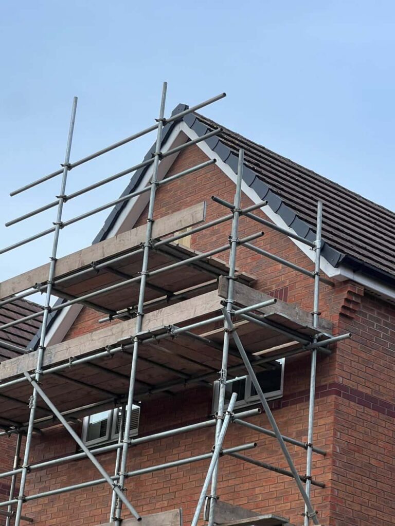 This is a photo of a roof which has just been repaired. There is a scaffold located at the gable end for access onto the roof. Works carried out by Retford Roofing Repairs